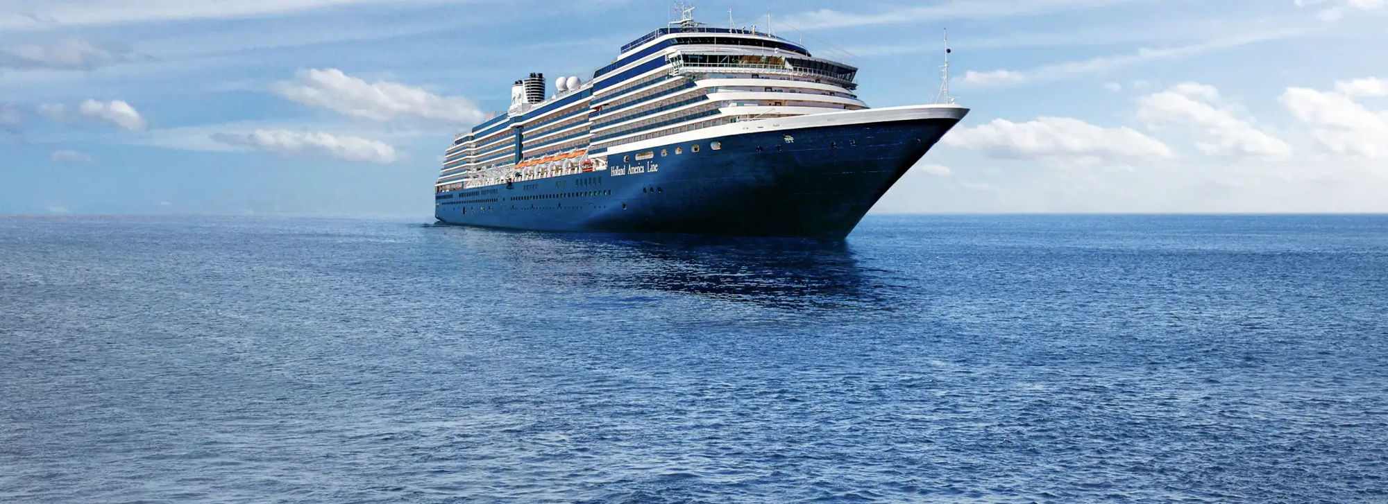 Blue Ocean Cruise Ship Sailing A large, elegant blue cruise ship sailing smoothly across a calm, expansive blue ocean under a partly cloudy sky. The vessel appears to be a modern, luxurious liner with multiple decks and sleek design.