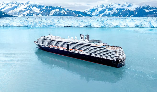 A large cruise ship sailing through turquoise waters with dramatic snow-capped mountains and a massive blue glacier in the background, showcasing the stunning Alaskan wilderness.