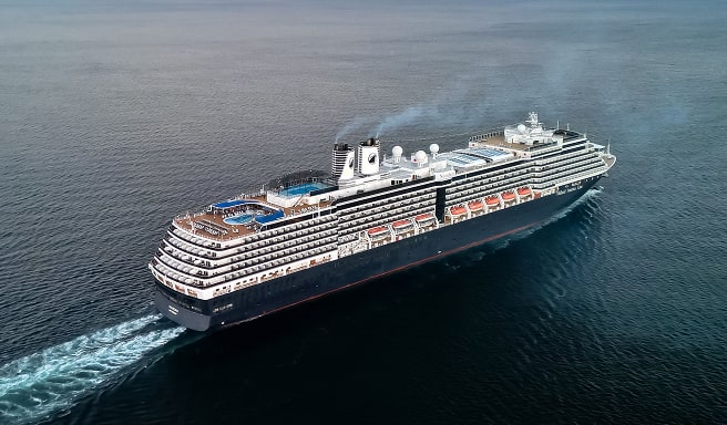 Modern Cruise Ship Sailing Open Waters A large, sleek cruise ship navigating across a calm blue ocean, viewed from an aerial perspective showing its full profile and wake.