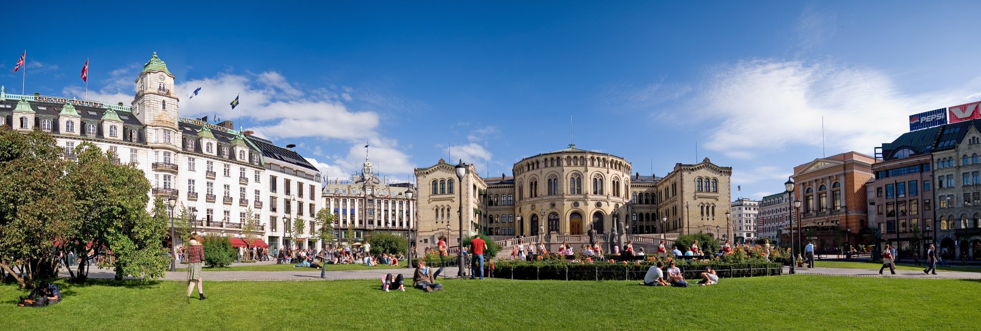Geothermal hot spring in Iceland with steaming turquoise waters surrounded by rugged volcanic landscape and dramatic cloudy sky.