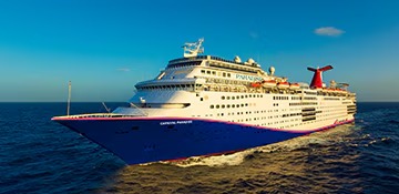 Carnival Paradise Cruise Ship at Sea A large cruise ship operated by Carnival Cruise Lines sailing on open ocean waters under clear blue