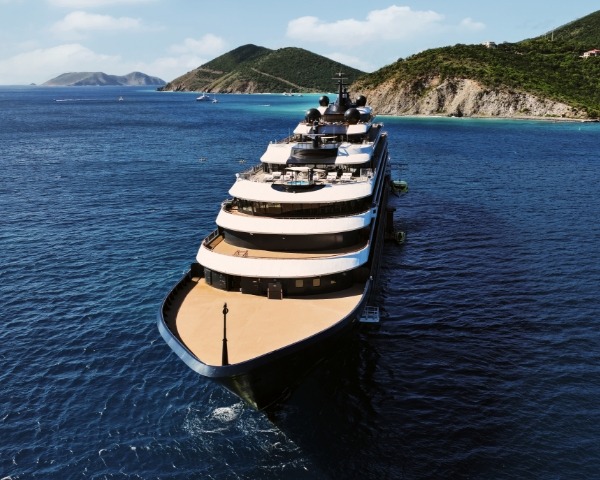 Luxury Yacht Aerial View in Mediterranean Waters An aerial photograph of a large luxury expedition yacht anchored in crystal-clear Mediterranean