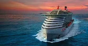Virgin Voyages Scarlet Lady Cruise Ship at Sea A modern luxury cruise ship at sea during golden hour, featuring the distinctive curved hull design